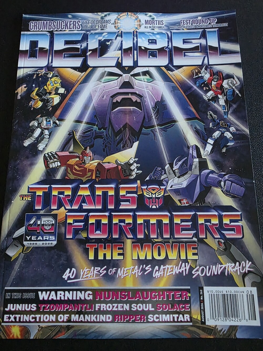August 2026 issue #262 of Decibel Magazine - Transformers The Movie Cover